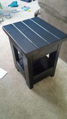 a coffee table sitting on top of a carpeted floor