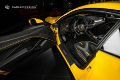 the interior of a yellow and black sports car