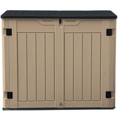 a tan storage shed with black roof