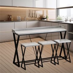 three stools and a table in a kitchen