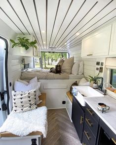 the interior of a camper with white walls and wood flooring is shown in this image