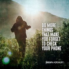 a person walking through tall grass with the words do more things that make you forget to check your phone