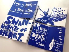 four blue and white books with different designs on them