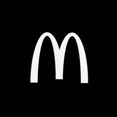 a black and white photo of a mcdonald's logo with the letter m on it