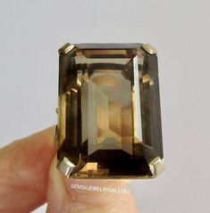 WELCOME TO                GEMSnJEWELRYGALLERY We offer you a broad varity of loose gemstones and exclusive jewellery pieces on best prices. Main Stone:  Smokey quartz Stone Size: 15×20mm Stone Shape:Emerald Cut Material:Solid Silver Finish With Rhodium Customer Satisfaction is our Top Most priority. "Note:Gemstone is Natural not lab Grown. Metal: 925 Silver (Solid 10K/14K/18K White Gold/Yellow Gold/Rose Gold) available to customize,plz feel free to contact us. Ring Size: We usually offer US size Smokey Topaz Ring, Smokey Quartz Ring, Smoky Quartz Ring, Smokey Topaz, Emerald Cut Rings, Exclusive Jewelry, Quartz Ring, Smokey Quartz, Quartz Stone