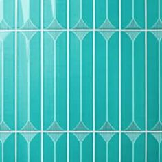 a blue tiled wall with white lines on it