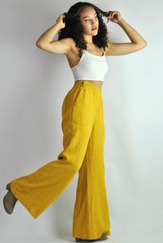 "This is our no. 83 of our Conscious Clothing Concept. This fantastic summer sunny yellow loose fitting elasticated pants are made of pure softened European linen. They are great for a casual style as well as the elegant evening. Very cconfident and elegant summer look. It has got 2 pockets on the back and 2 pockets on the sides. It is the ultimate fabric for hot weather as it breathes and absorbs moisture better that any fabric on earth. This time the fabric is heavier that usual, which makes t Yellow Flowy Pants Outfit, Summer Wide Leg Pants With Pockets, Linen Full Length Bottoms For Vacation, Summer Wide Leg Relaxed Fit Harem Pants, Vacation Linen Full-length Bottoms, Summer Wide Leg Harem Pants, Summer Harem Pants Relaxed Fit Wide Leg, Solid Color Summer Wide Leg Full Length Pants, Summer Full Length Solid Wide Leg Pants