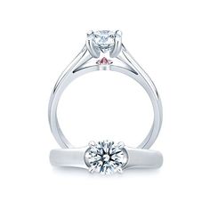 a white gold engagement ring with a round cut diamond