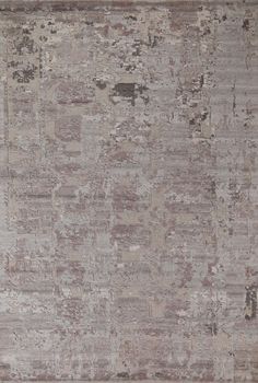 an area rug with many different colors and patterns on it, including greys, beiges, browns and tans