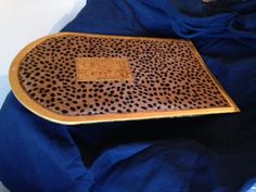 a leopard print tray sitting on top of a blue blanket