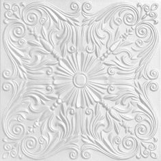 an intricately designed ceiling tile in white