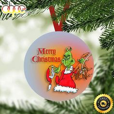 a christmas ornament hanging from a tree with the words merry christmas written on it