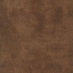 a brown area rug is shown in the middle of an image, with a white border