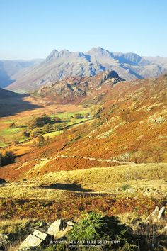 the mountains are covered in autumn foliage and there is no image on this page to describe