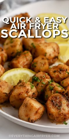 chicken and easy air fryer scallops on a plate with lemon wedges