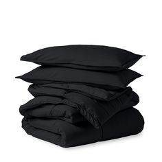 four black pillows stacked on top of each other