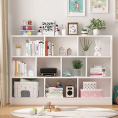 This is a modern style white bookcase, with different sizes of shelves to meet your storage needs of different sizes of books. Not only can it be used as a bookcase, but it can also be used as a display cabinet, you can put your own trophies, family photo albums, green plants, etc. on it, to dress up your warm and lovely home for you. FUFU&GAGA 41.3-in H x 55.1-in W x 9.8-in D White Composite Wood 10 Cube Organizer | LJY-JWL0113-04 Cube Shelving Ideas, Organizer Decor Ideas, 8 Cube Organizer Decor, Cube Organizer Decor, Album Shelf, 8 Cube Organizer, Cube Drawers, Basement Playroom, Storage Organizers