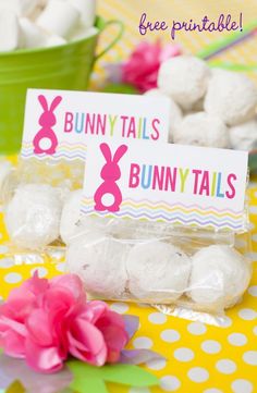 bunny tails and bunnies are on the table next to each other with candy in them