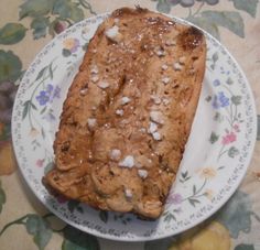 a piece of bread sitting on top of a white plate