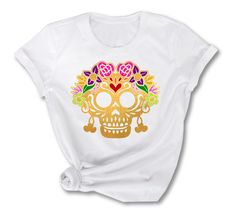 Sugar Skull T-shirt ♥ Custom designs available. ♥ Features: 4.5 oz., 100% polyester moisture management jersey. Sewn with 100% polyester thread. Ribbed collar Shoulder-to-shoulder self-fabric back neck tape Double needle sleeves and bottom hem Side seam construction EasyTear label Machine washable/ tumble dry low ♥ Wash inside out in cold water, dry on low temperature. (DON'T USE BLEACH) ♥ For sizing information and color options, please see listing images. ♥ SOLD INDIVIDUALLY ♥. The price is on Teenager Birthday Gifts, Teenager Birthday, Gift Flowers, Flowers Graphic, Pretty Pillow, Skull T Shirt, Label Machine, Skull Tshirt, Flower Gift