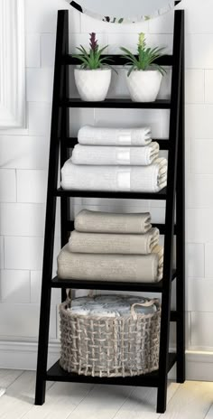 a shelf with towels and baskets on it