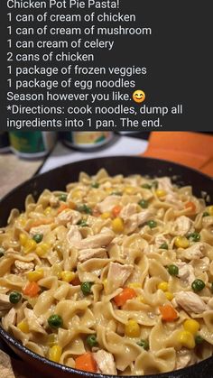 a pan filled with pasta and vegetables on top of a table