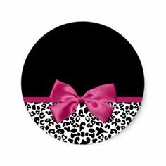 a black and white leopard print with a pink bow