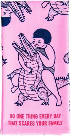 a pink towel with an image of a woman hugging a crocodile