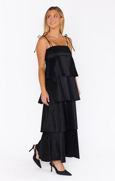 Simple, yet stunning, our Meet Cute Dress is sure to turn heads! Adjustable straps keep you comfortable while tiered ruffles lead this delicate black taffeta dress into a midi hem. Dance the night away in your fave pair of strappy heels and delicate jewelry. Black Taffeta Dress, Maternity Dress Wedding Guest, Meet Cute, Bridal Party Accessories, Maternity Bridesmaid Dresses, Floral Bridesmaid Dresses, Plus Size Bridesmaid, Taffeta Dress, Bridesmaid Dresses Plus Size