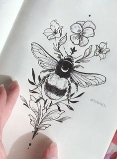 a drawing of a bee with flowers on it