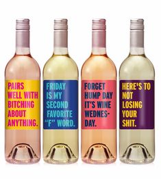 three bottles of wine with words on them