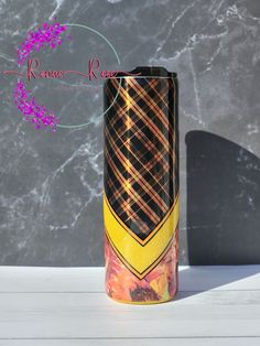 a tall vase sitting on top of a white table