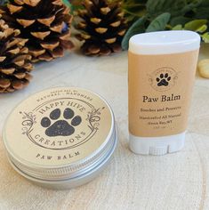 the paw balm is next to an empty jar