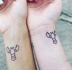 two people with matching tattoos on their wrists, one has a bee and the other has a lobster