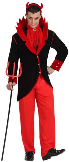 a man in a devil costume is holding a cane