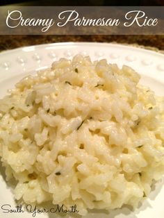 creamy parmesan rice on a white plate with text overlay that reads creamy parmesan rice