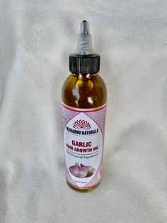 Handmade 6oz Ingredients: Organic Extra Virgin OIive Oil, Organic Garlic and Essential Oils Blend 1). Promotes Hair Growth 2). Nourishes and Strengthens Hair 3). Improves Blood Flow to the Scalp 4). Kills Bacteria or Fungi living in the Scalp 5). Prevents Split Ends Garlic has anti-microbial properties that help kill germs and bacteria, which are responsible for causing damage to the scalp, further inhibiting hair growth. Raw garlic is known to be rich in Vitamin C that is great for promoting ha Garlic Hair Growth, Hair Oil Scalp, Garlic For Hair Growth, Hair Growth Tablets, Hair Regrowth Women Remedies, Hair Regrowth Remedies, Hair Growth Pills, Natural Hair Regrowth, Hair Regrowth Treatments