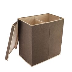 an open cardboard box sitting on top of a white floor