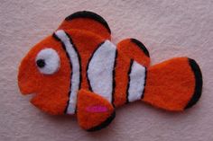 an orange and white clown fish brooch