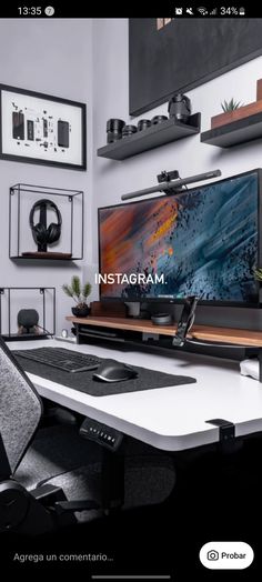 a desk with a monitor and keyboard on it