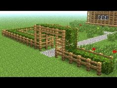 an image of a farm in minecraft with grass and flowers on the fenced area