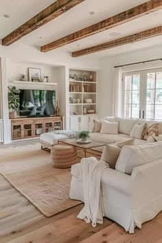 a living room filled with furniture and a flat screen tv