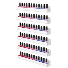 three white shelves with different colored nail polishes