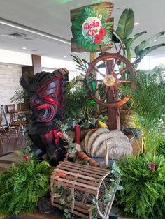 an assortment of plants and decorations in a room