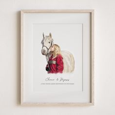 a painting of a woman and a horse in a white frame on the wall next to it