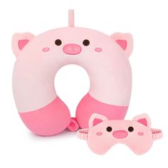 an inflatable toy with a pink pig on it and a sleeping mask next to it