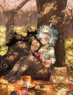 two people sitting in the woods next to each other