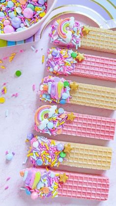 several waffles with sprinkles and candy on them