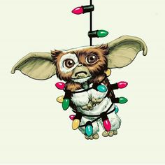 an animal hanging from a string with christmas lights on it's head and eyes