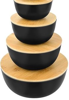 three black bowls stacked on top of each other